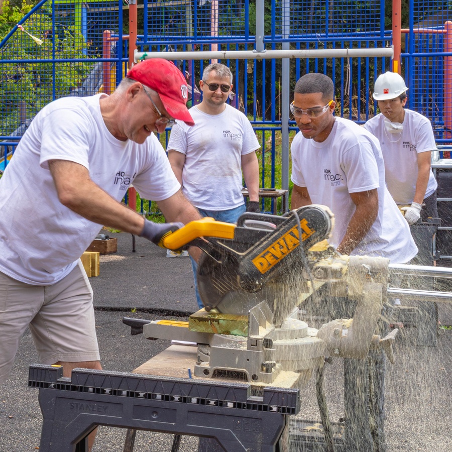 HOK volunteers cutting wood during an HOK Impact event in London