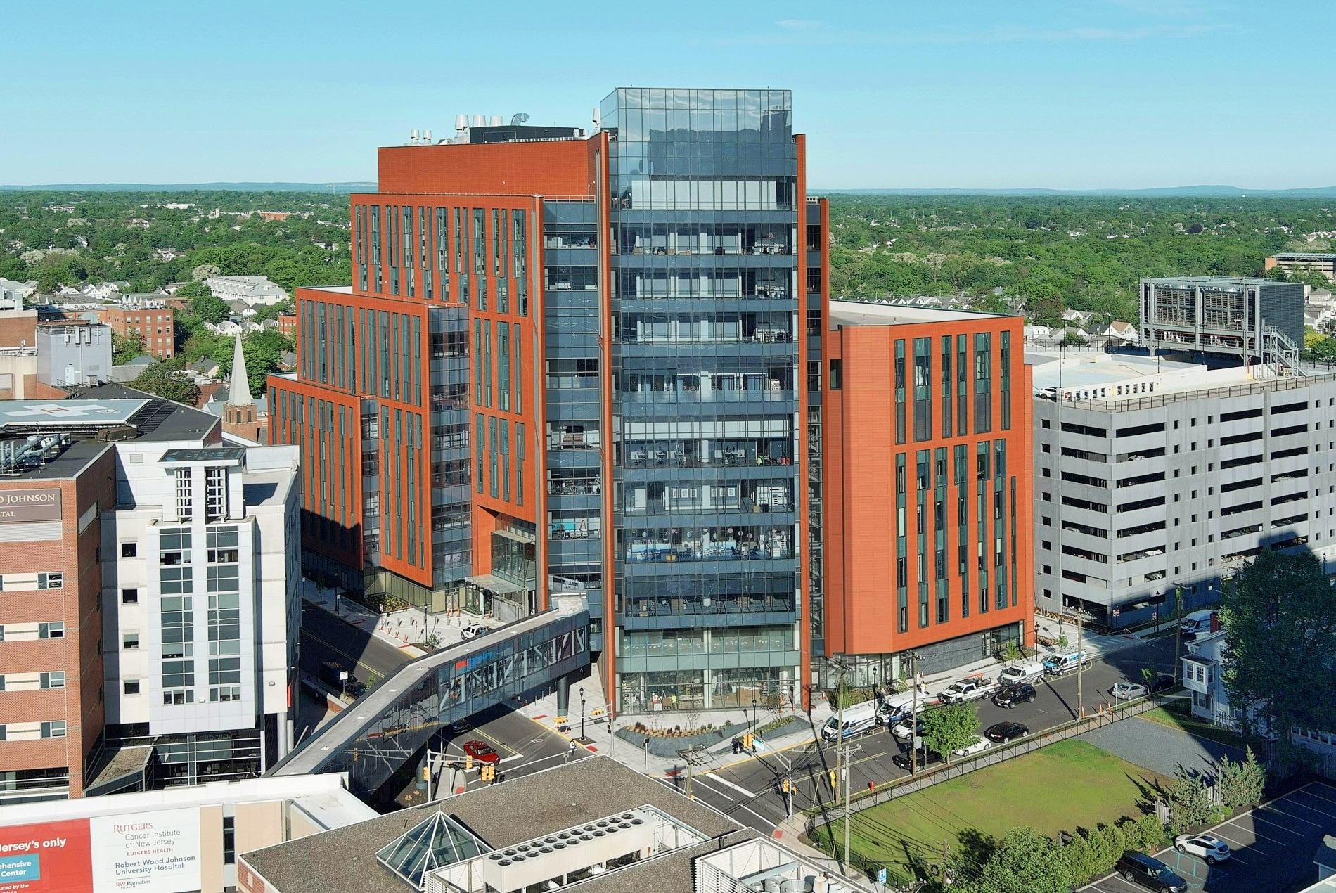 Evening exterior of the Jack & Sheryl Morris Cancer Center, designed by HOK