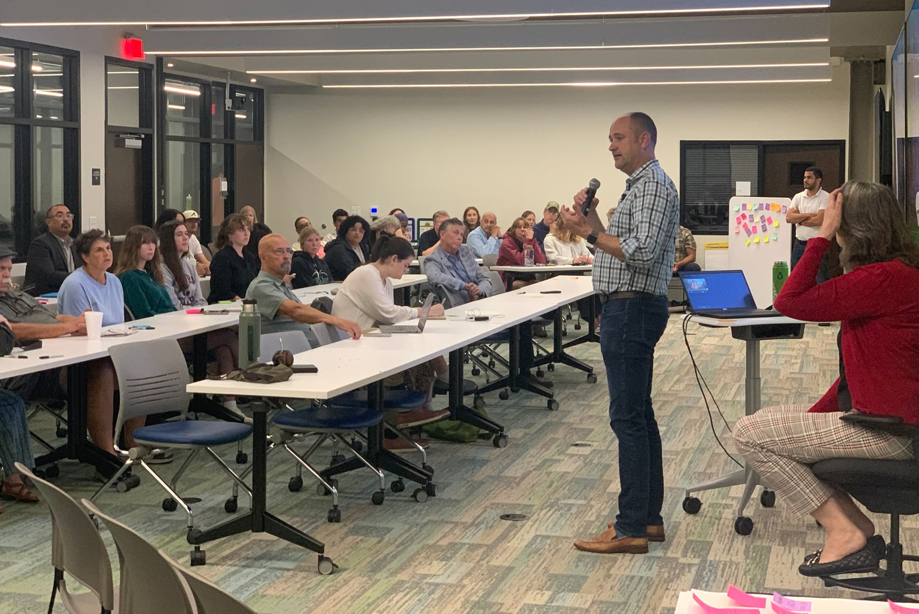 Photo of a conference room with HOK's Sean Quinn leading a workshop with Catawba College faculty and students.