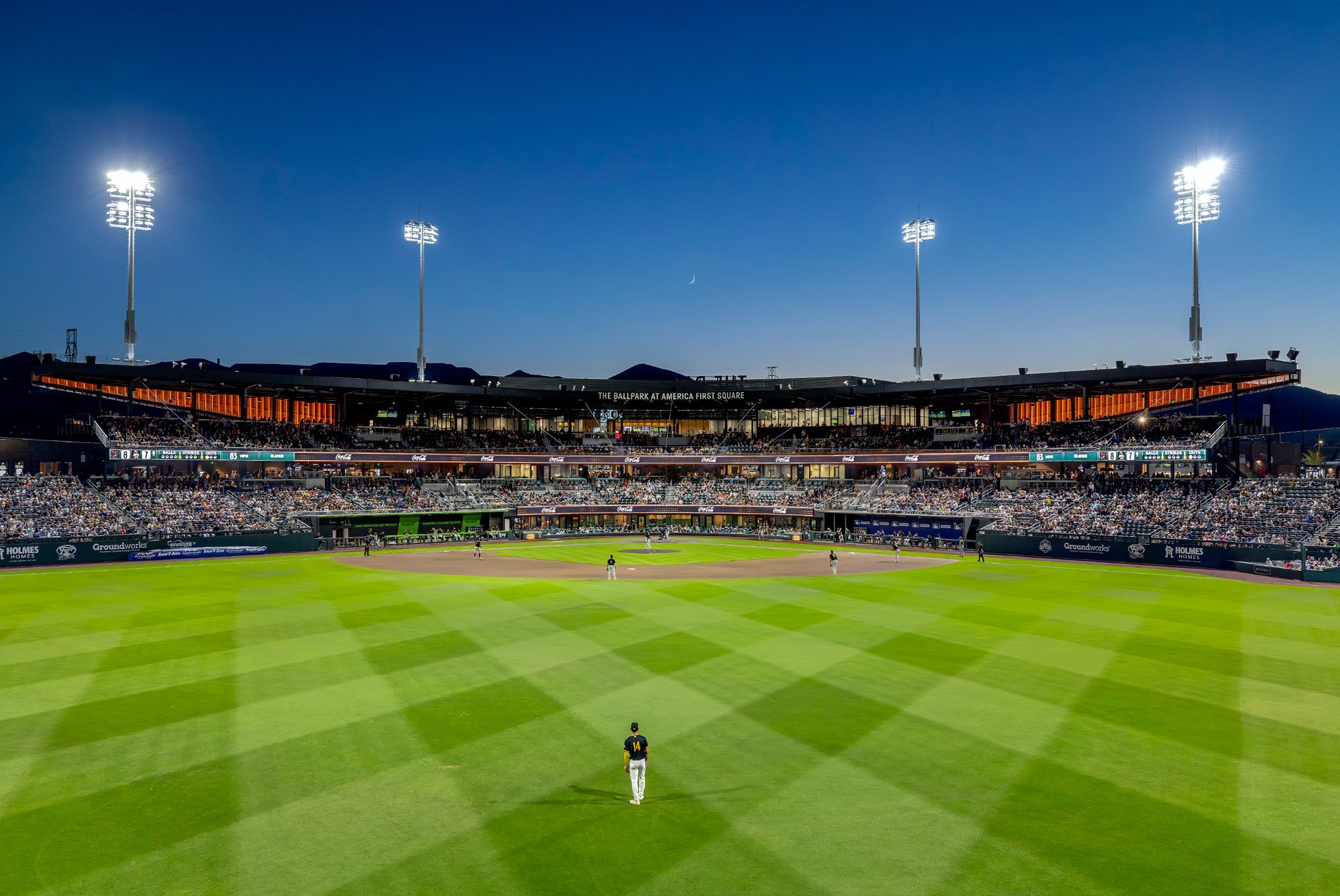 Exterior night shot of field during a game at The Ballpark at America First Square, home of the Minor League Baseball's Salt Lake Bees.