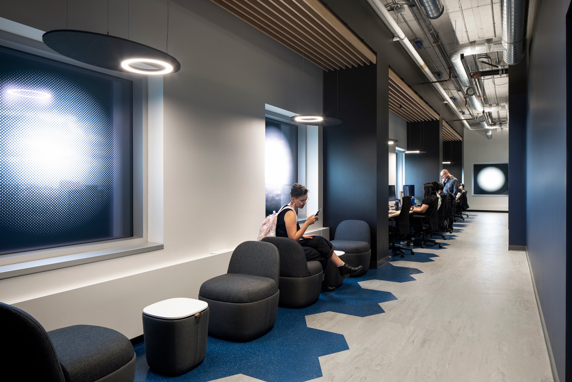 Inviting lounge spaces and hoteling stations are thoughtfully incorporated throughout the University of Ottawa's Cyber Range.