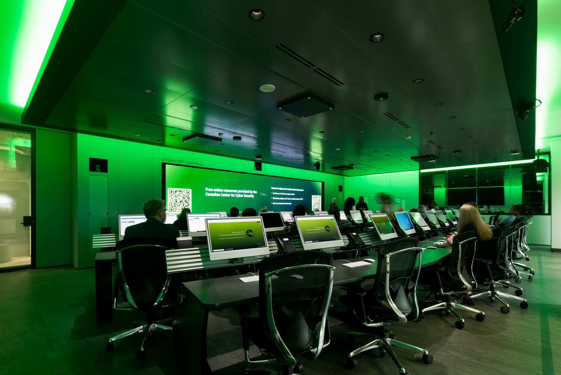 The simulation room, complete with individual workstations, phones and integrated lighting at the University of Ottawa's new Cyber Range.