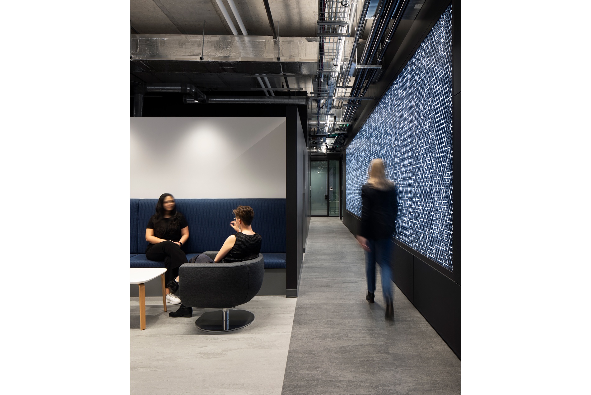 Lounge spaces and a dynamic digital wall at the University of Ottawa's new Cyber Range.