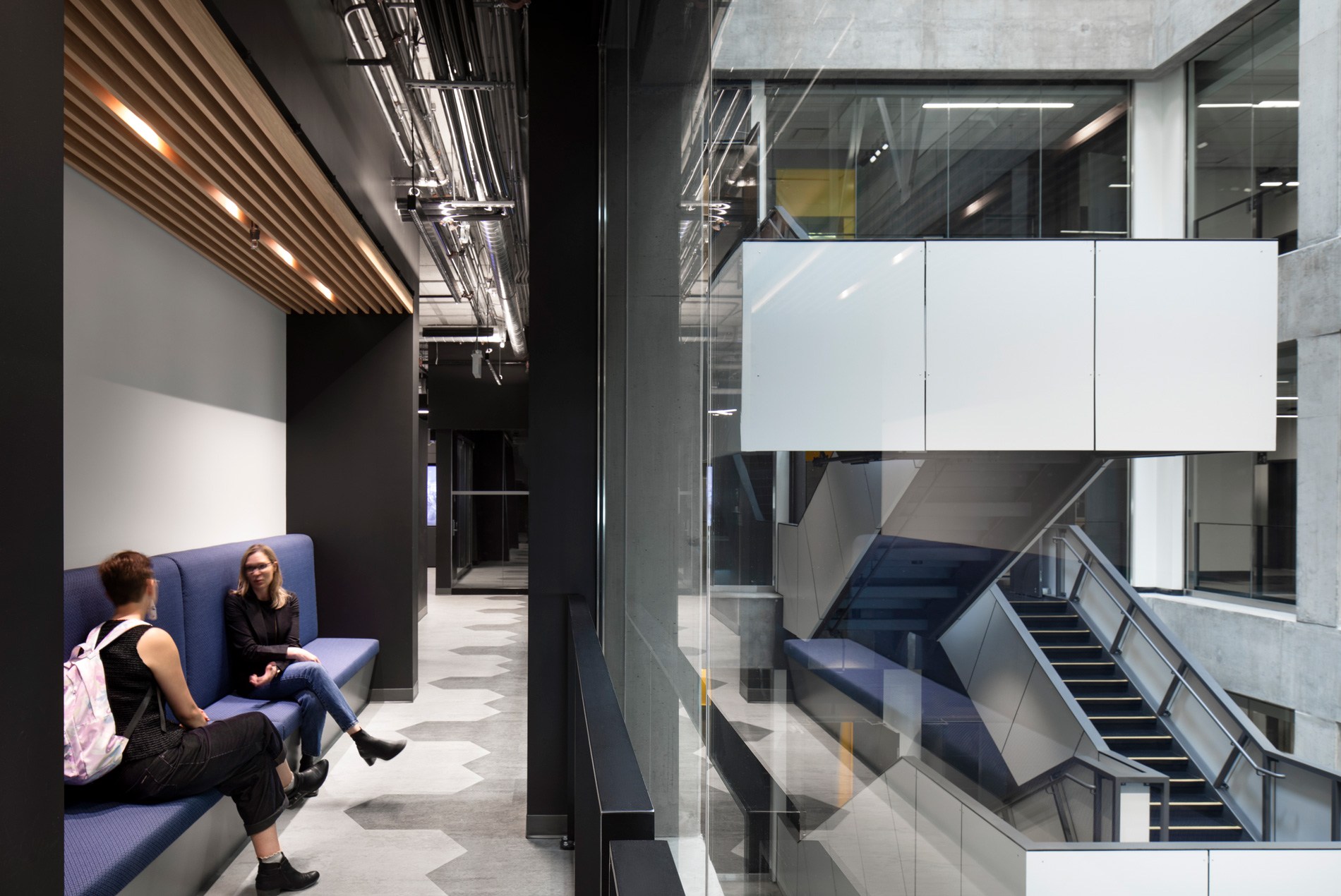Lounge spaces overlooking the main stairwell at the University of Ottawa's Cyber Range.