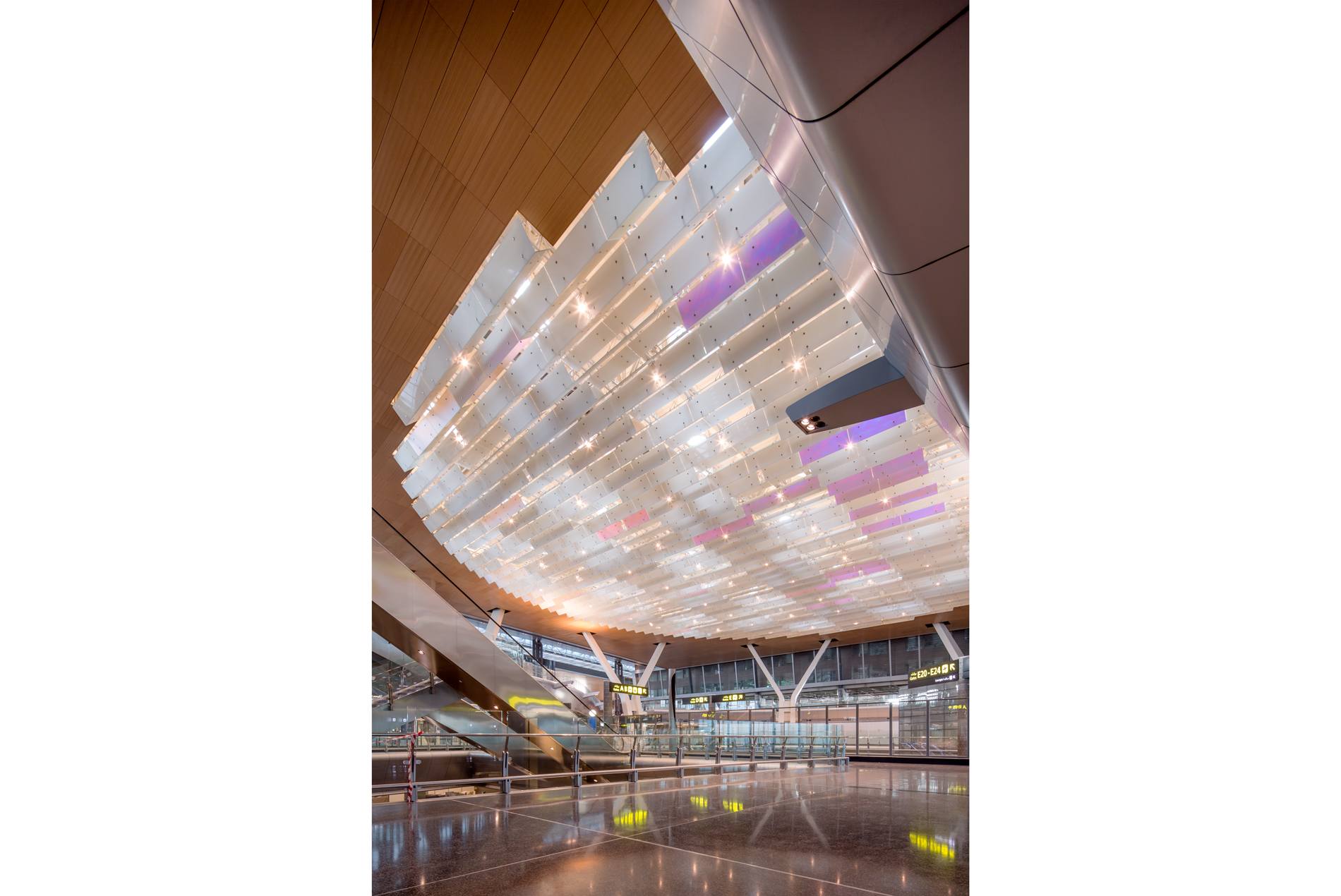 Dichroic glass ceiling at the HOK-designed Hamad International Airport in Qatar.