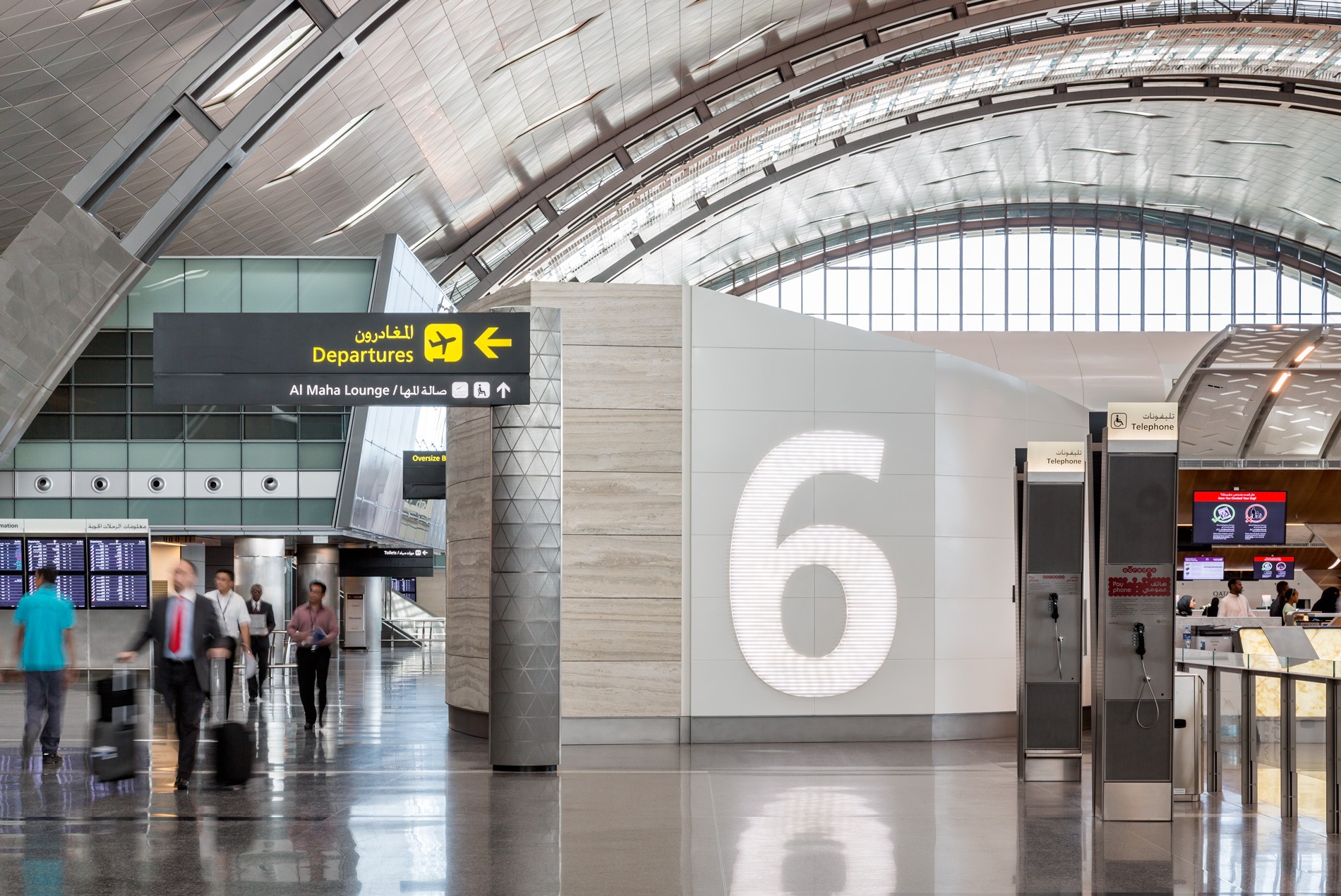 HOK-designed customer service kiosks with easy signage and wayfinding within the departures hall at Hamad International Airport