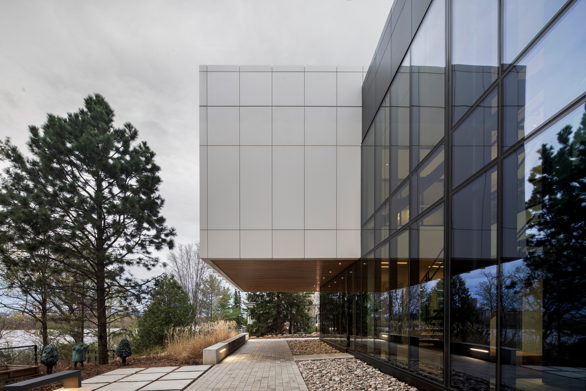 HOK-designed British High Commission exterior with a building overhang serving as a canopy under the pedestrian pathway.