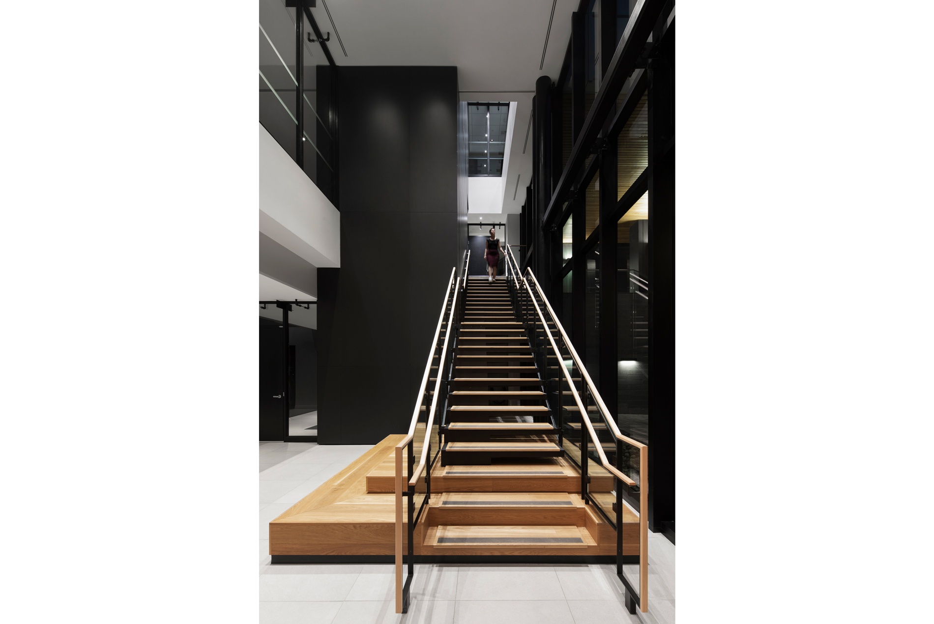 Stairwell with integrated wooden seating for collaboration inside the HOK-designed British High Commission in Ottawa.
