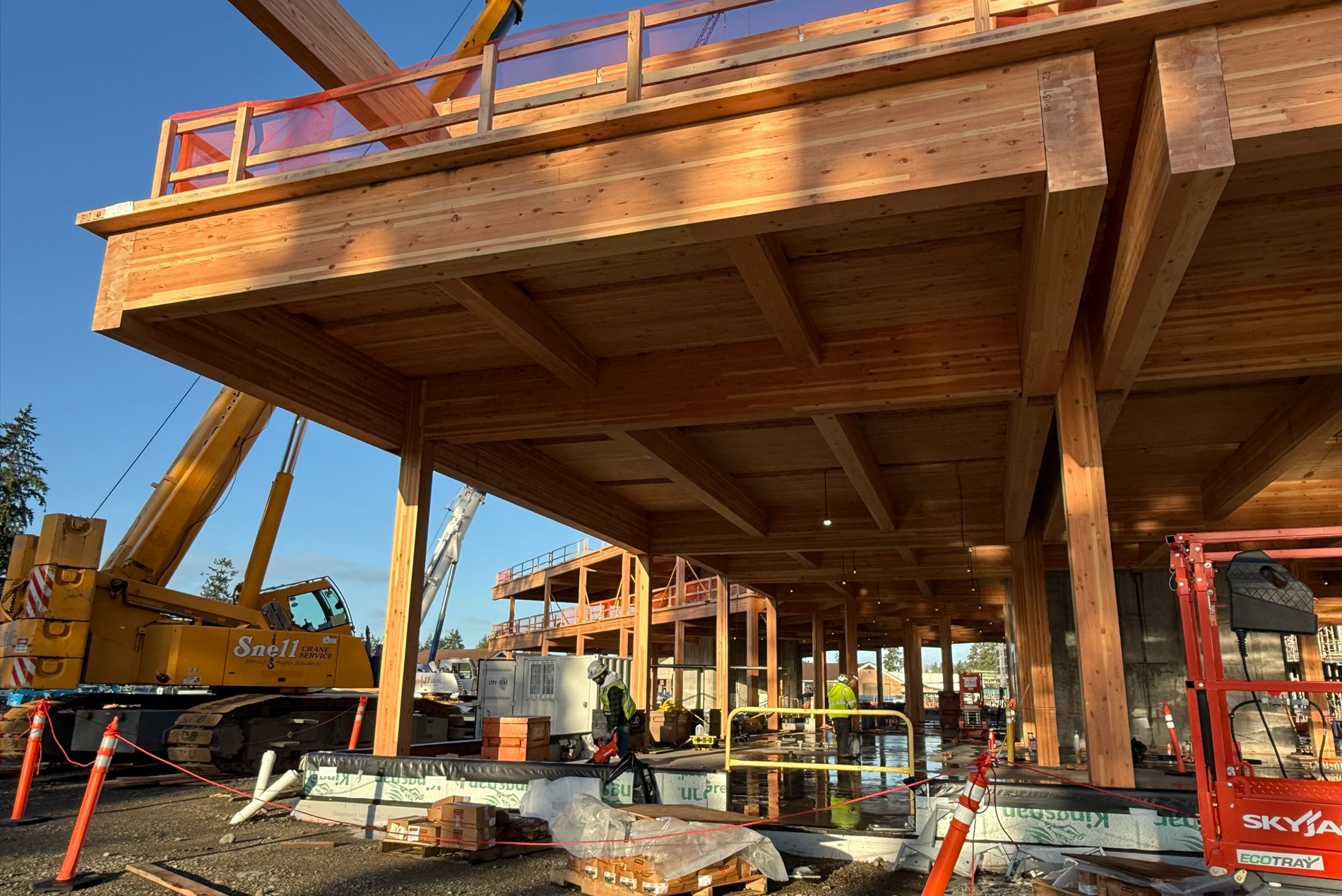 Construction photo showing glulam wood columns and beams at Western State Hospital’s new administration building, designed by HOK.