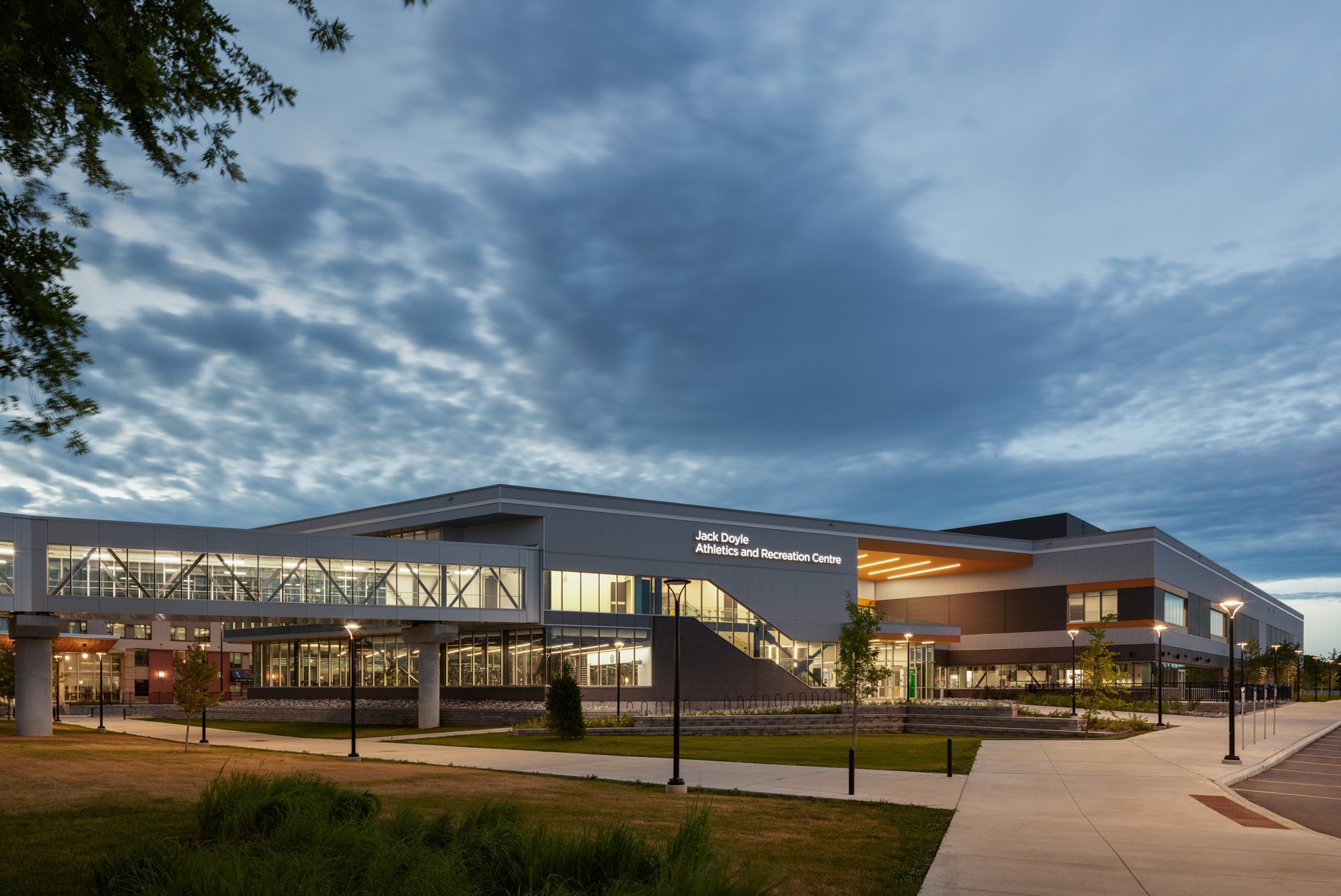 HOK-designed Algonquin College Jack Doyle Athletics and Recreation Centre exterior at dusk