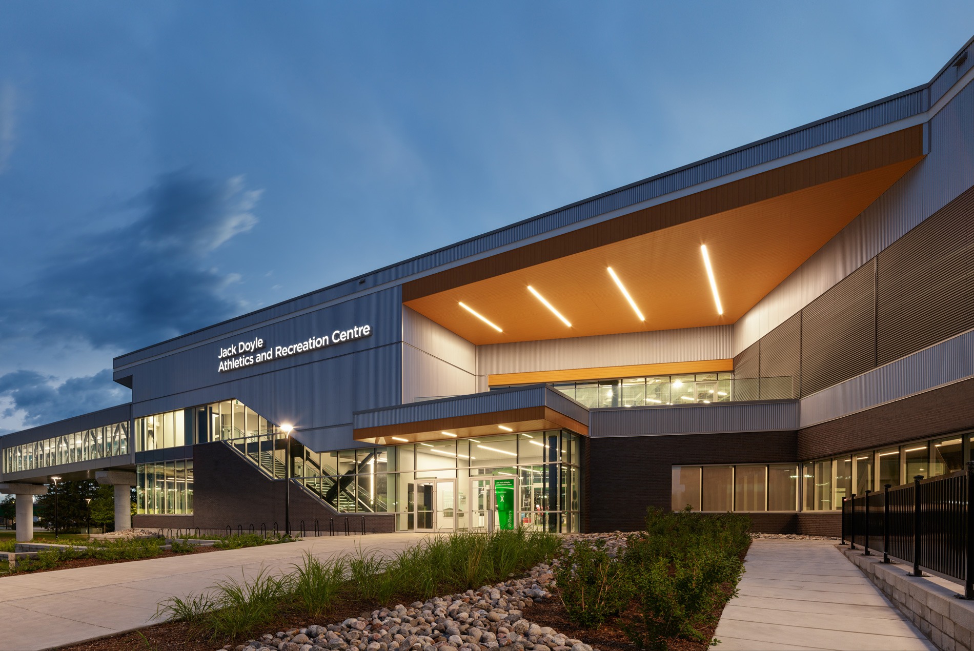 HOK-designed Algonquin College Jack Doyle Athletics and Recreation Centre exterior at dusk