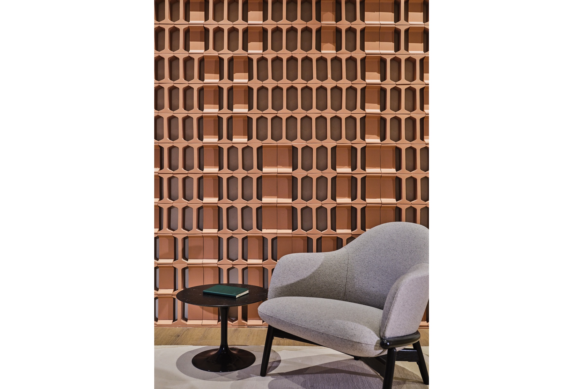 Curated terracotta wall honoring Houston's bayou cisterns for a confidential Houston office, designed by HOK
