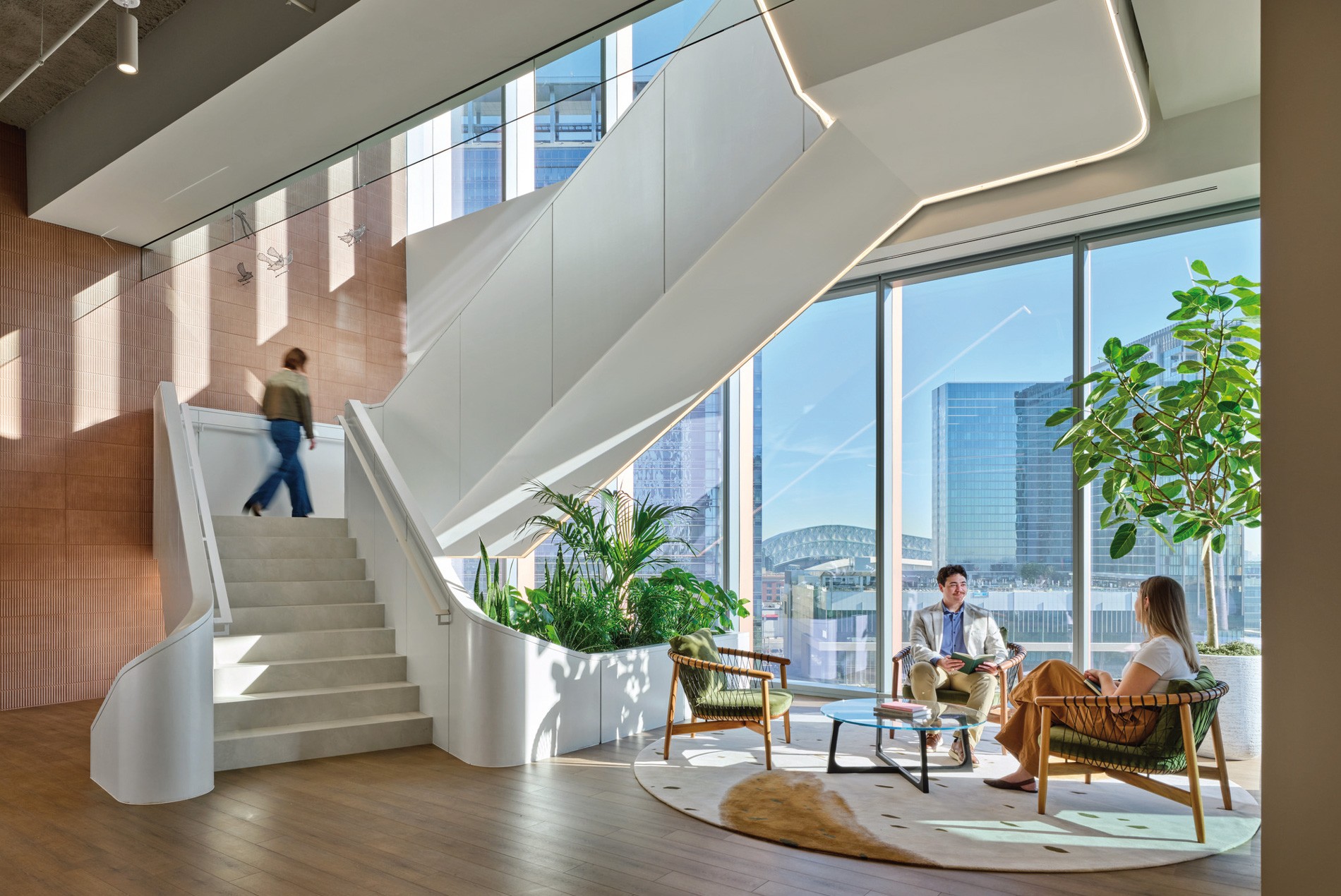 Wooden stairwell, seating and live plantings for a confidential Houston office designed by HOK