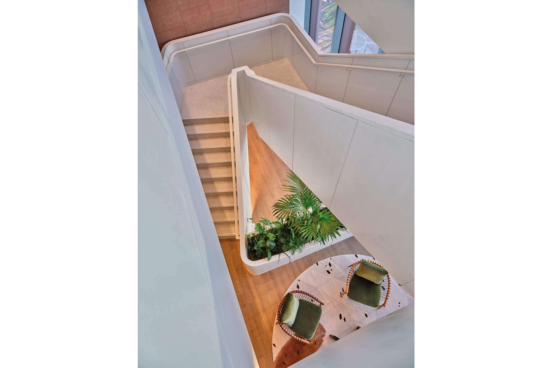 Wooden stairwell and live plantings for a confidential Houston office designed by HOK