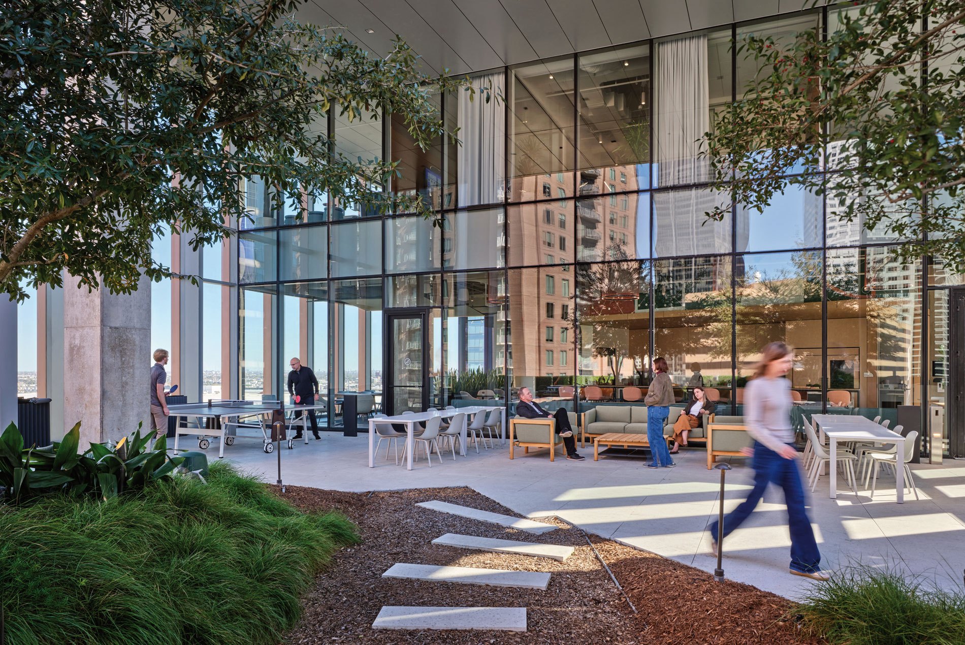 Outdoor terrace with landscaping, seating and games for a confidential Houston office designed by HOK