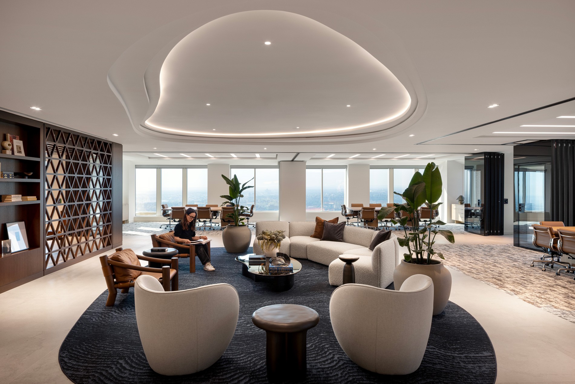 Client lounge and meeting rooms with operable, opaque glass walls at HOK-designed Cassels law firm in Calgary