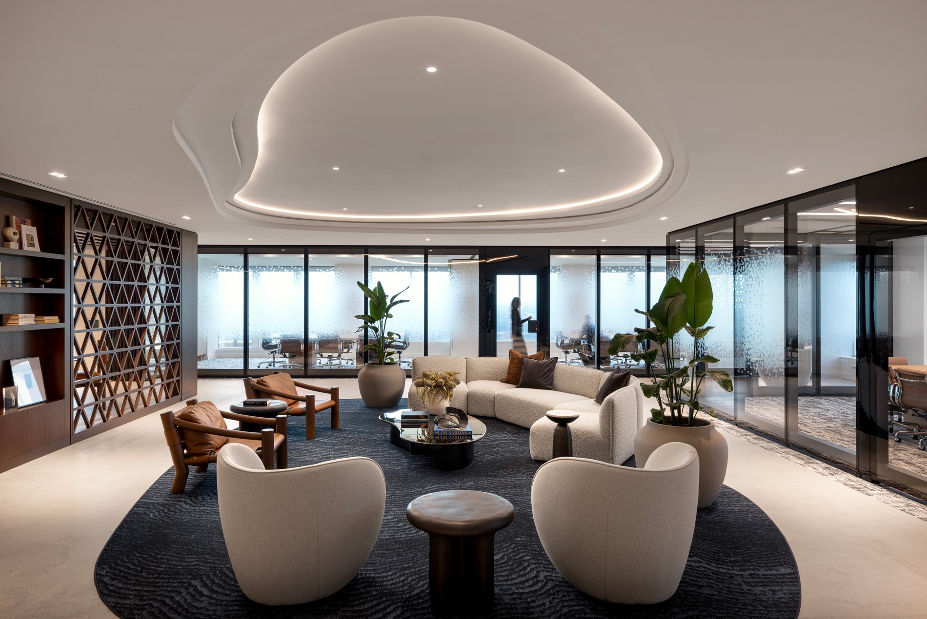 Client lounge and meeting rooms with operable, opaque glass walls at HOK-designed Cassels law firm in Calgary