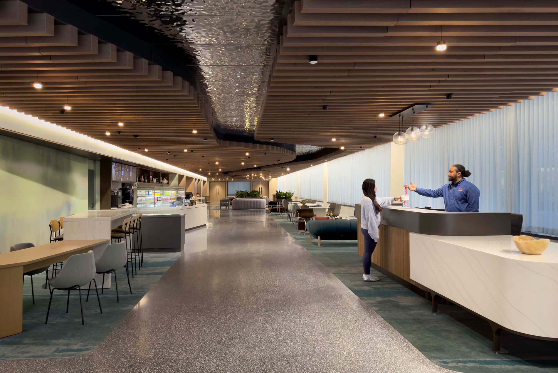 astrazeneca r&d center cafe with seating and concierge desk